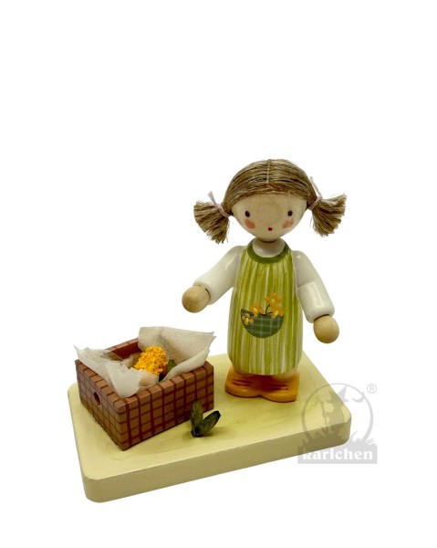 Girl with corn cobs