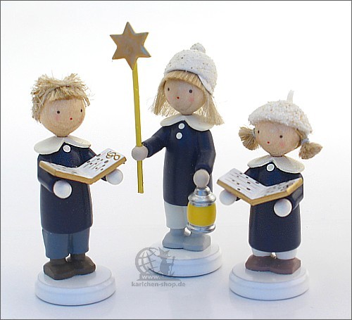 Carolers with music books and star, three-piece