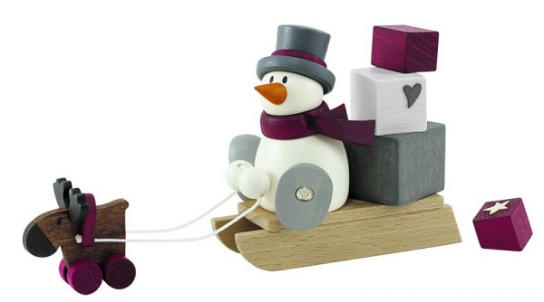 Snowman Otto on sled with gifts