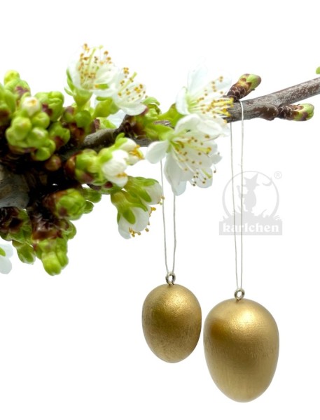 2 wooden Easter eggs, gold colored