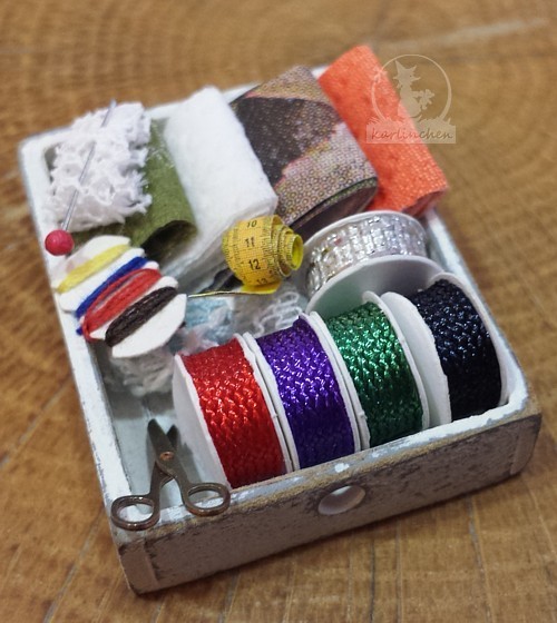 box with sewing supplies