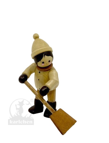 Little boy with snow shovel